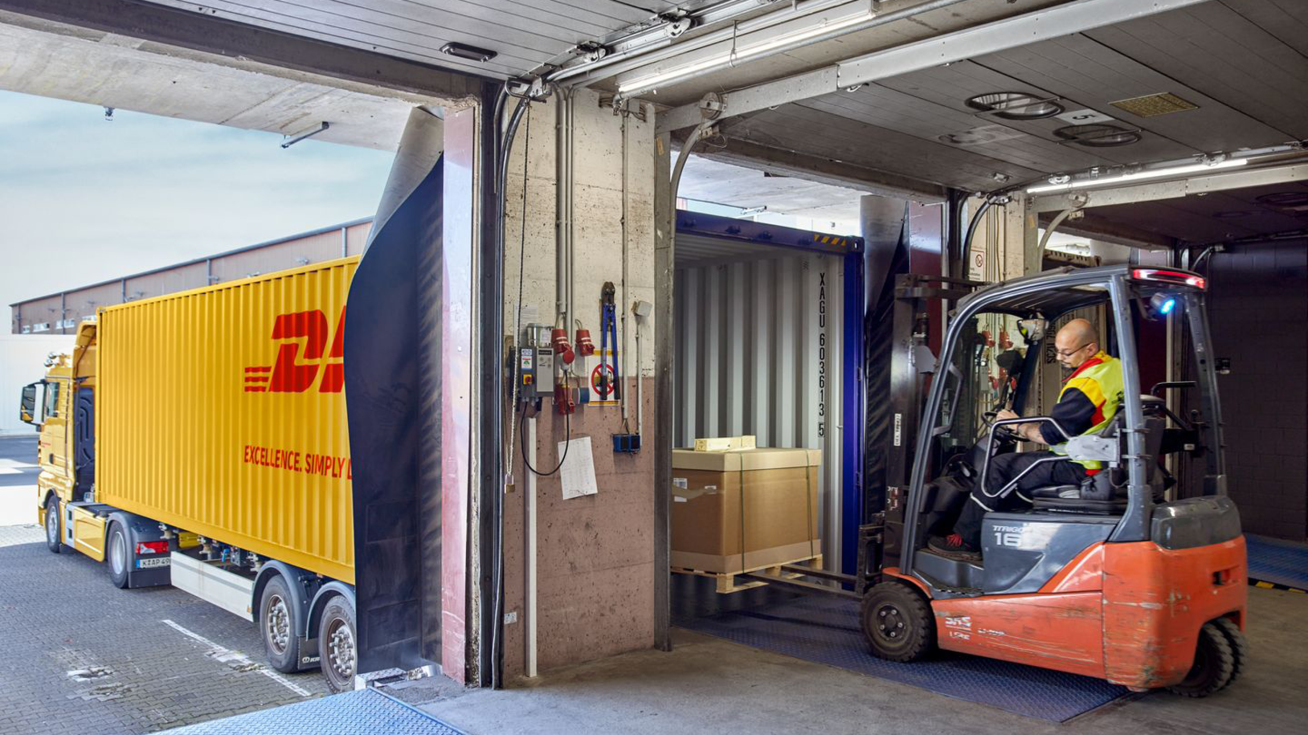 Forklift moves pallet into truck