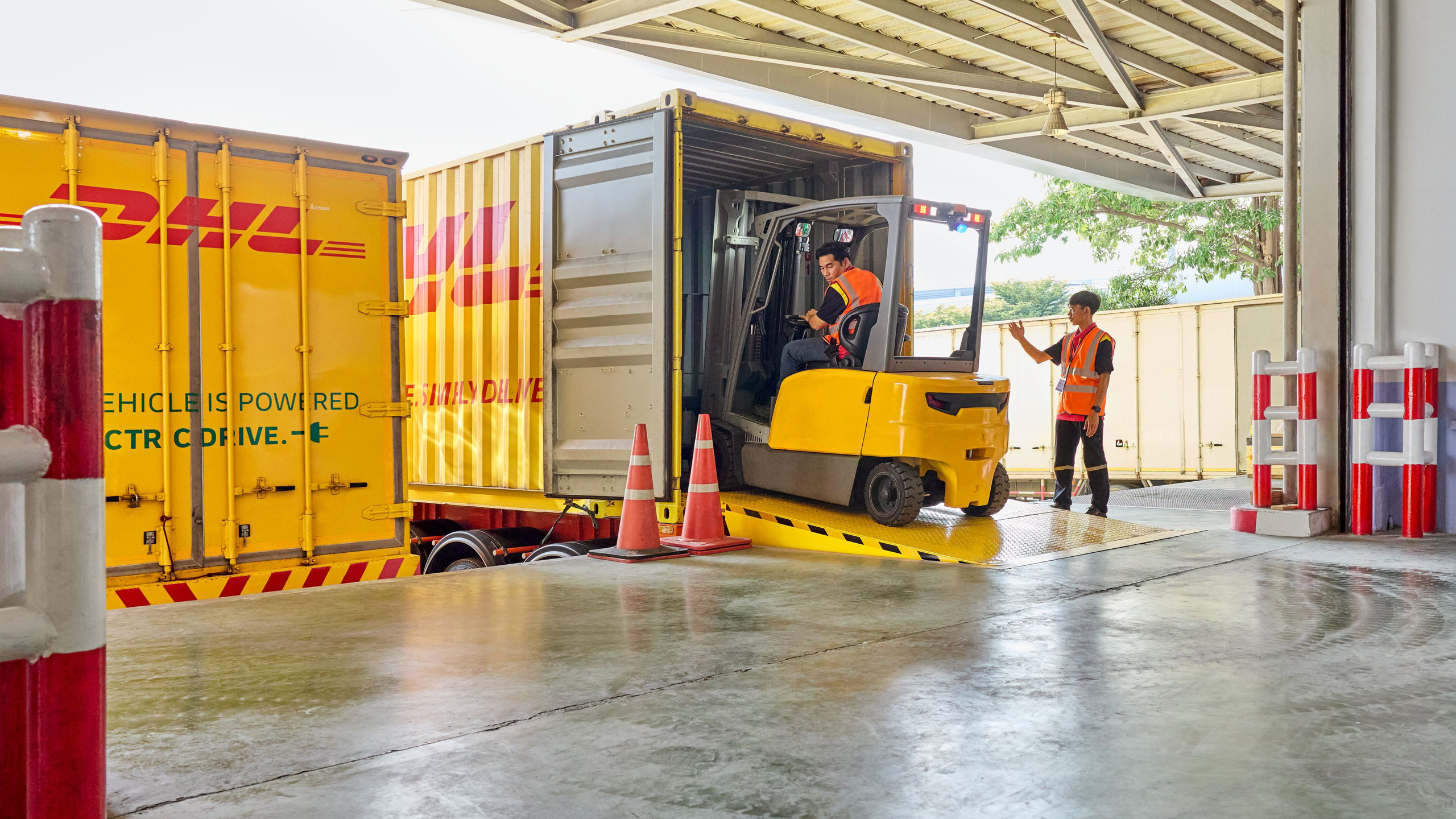 Forklift loading a truck at the ramp