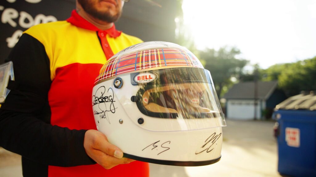 Unique racing helmet with signatures of all 20 living Formula 1® world champions