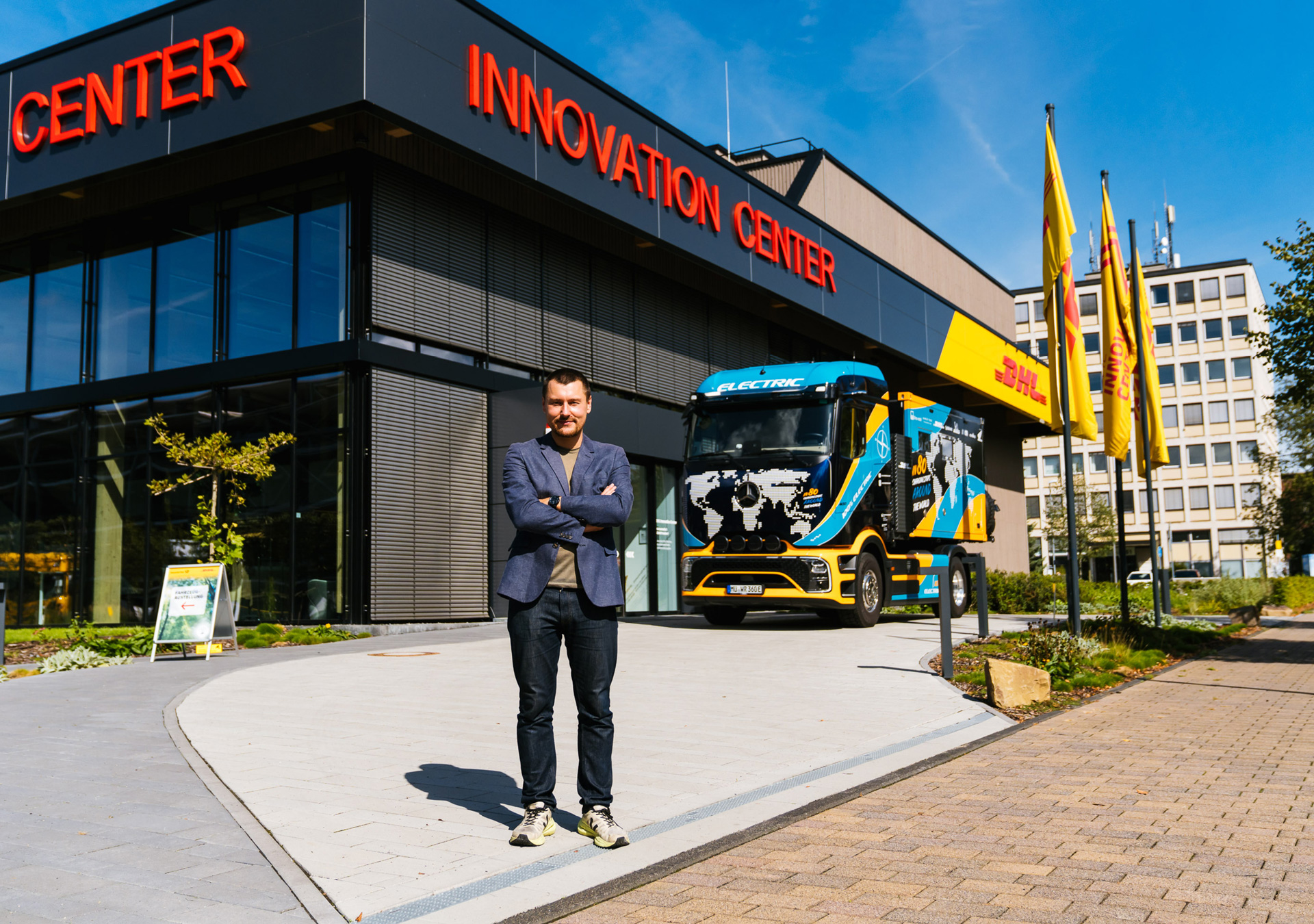 Elektrotrucker Tobias Wagner in front of the DHL Innovation Center in Troisdorf, Germany